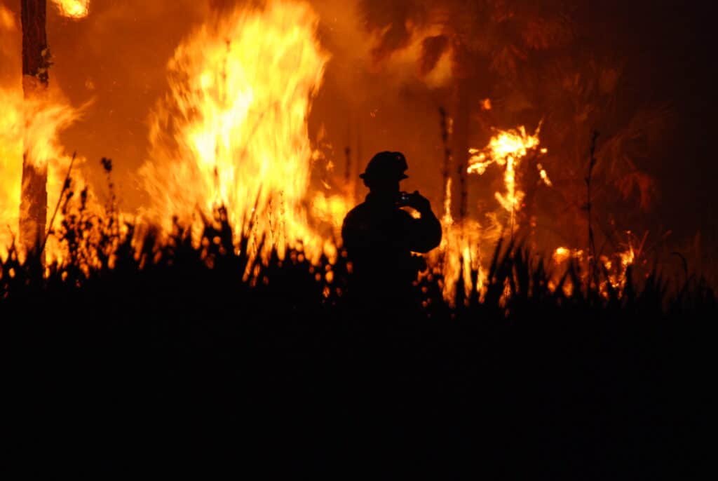 Firefighter in front of the Maui wildfire