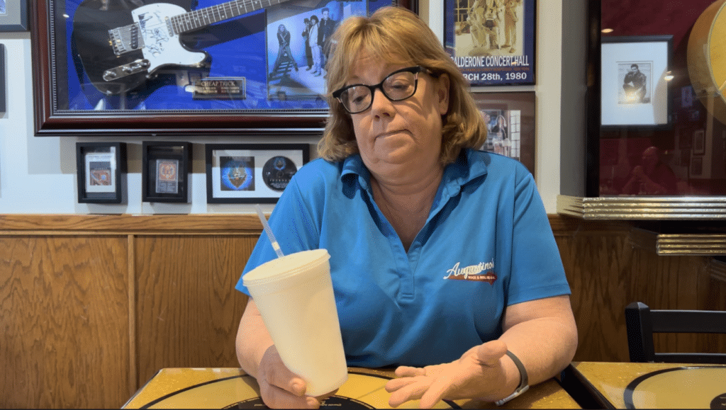 Augustino's Rock & Roll Deli Cathy with styrofoam cup