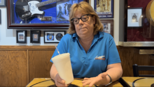 Augustino's Rock & Roll Deli Cathy with styrofoam cup