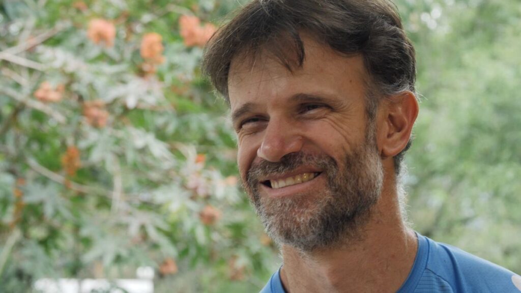 Sebastián “Zuko” Carrasco in Beyond The Fall preparing adaptive climbing equipment in the Ecuadorian mountains.