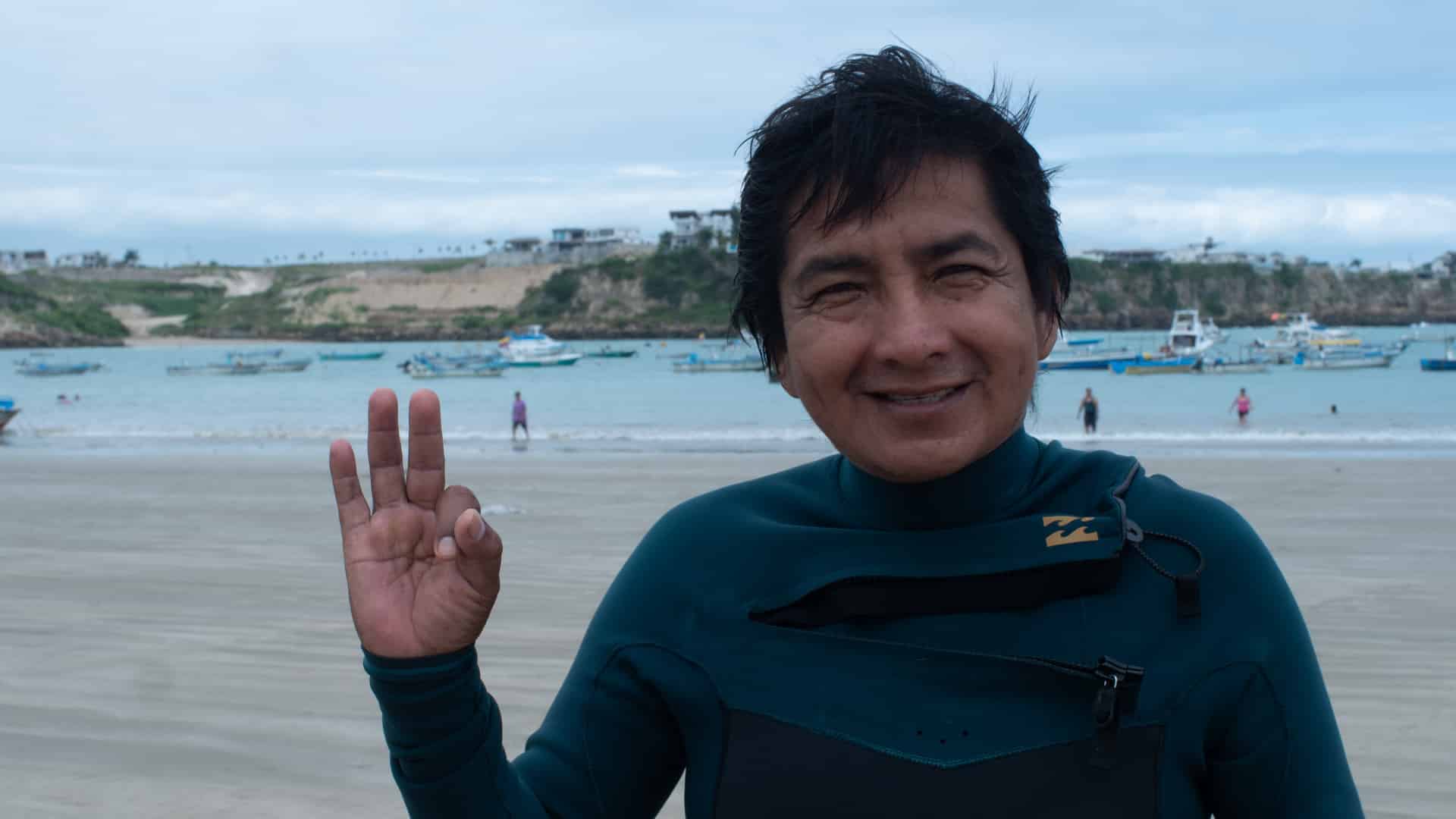 Ambrosio Yagual in a diving suit on the beach in Ayangue, Ecuador
