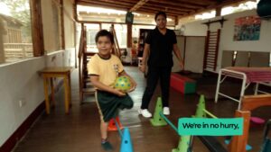 A child taking part in a movement activity at an inclusive school in Máncora